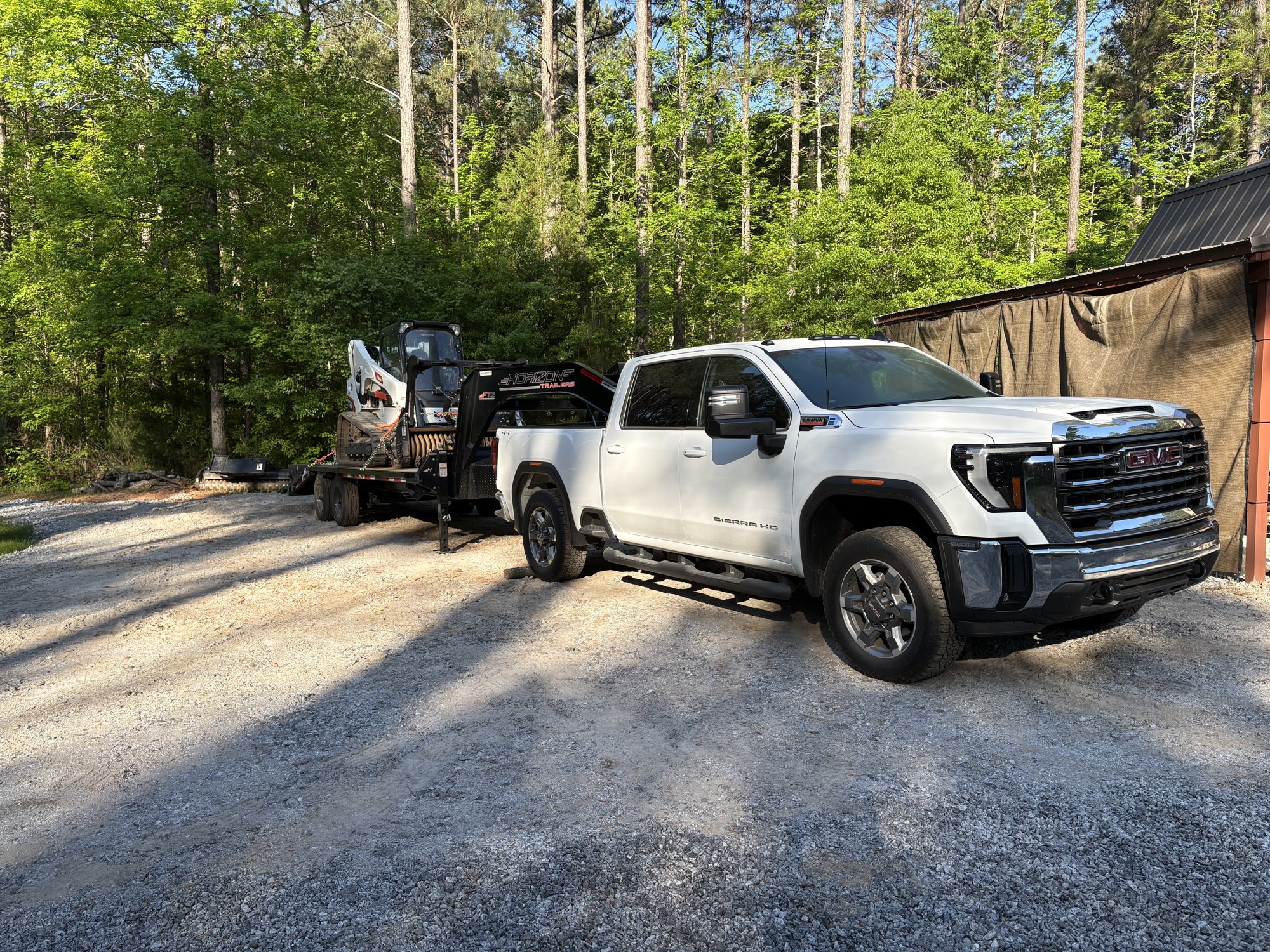 Forestry mulching in progress clearing dense underbrush on a Central Georgia lot